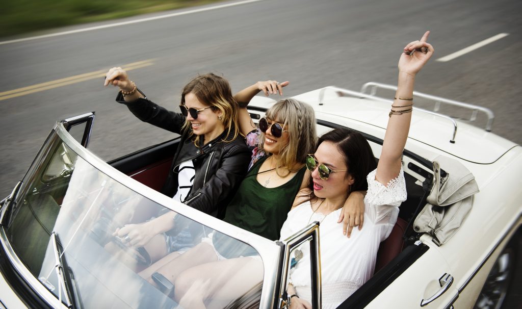 Diverse group of people enjoying a road trip and festival